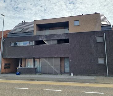 Knap gelijkvloers éénslaapkamerappartement met tuin en garagebox. - Photo 1