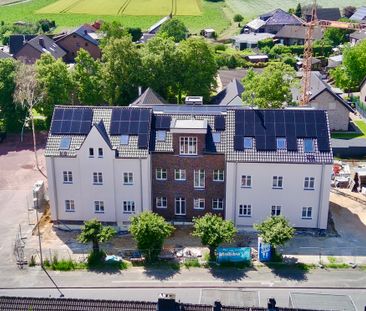 Ein architektonisches Highlight: Wohnen im historischen Schulgebäude mit modernster Technik! - Photo 1