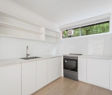 Sun-Filled Modern Townhouse with Stone Kitchen and Private Courtyar... - Photo 3