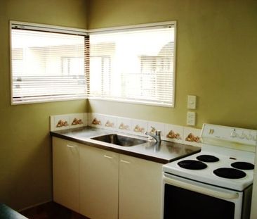 Fenced courtyard, garden and single garage with this two bedroom to... - Photo 2