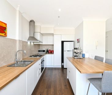 Designer Top Floor Two Level Apartment with Endless Views - Photo 6