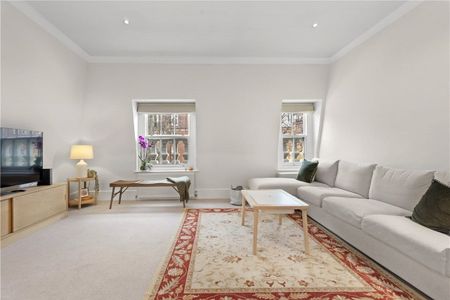 A fabulous, well presented and naturally bright three bedroom lateral apartment set on the third floor of this detached period villa on one of the most sought-after roads in Holland Park. Tenancy Length: Minimum 12 months EPC rating: C | Council Tax Band H - Photo 2