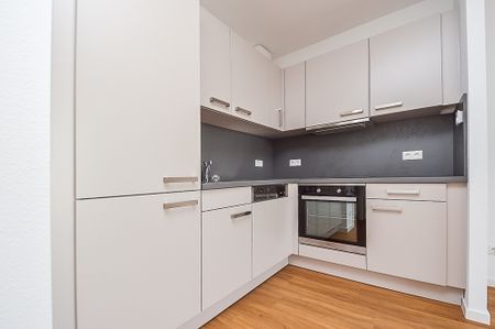 KOMFORTABEL WOHNEN - MIT AUFZUG, BALKON, FUSSBODENHEIZUNG UND EINBAUKÜCHE - Photo 4