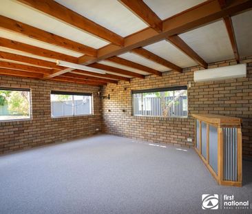 COMFORTABLE FAMILY LIVING ON A GENEROUS BLOCK - Photo 1