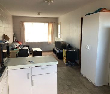 Tidy and spacious, this one-bedroom upstairs flat sits in a quiet b... - Photo 2