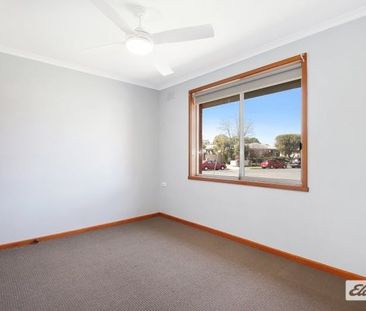 Charming 3-Bedroom Home with Modern Comforts & Outdoor Storage - Photo 1
