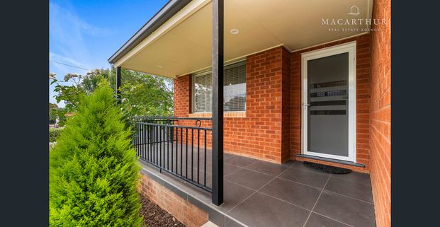 Charming Three-Bedroom Home with Low-Maintenance Appeal - Photo 1