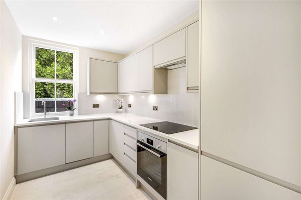 A recently renovated two bedroom fourth floor apartment benefitting from direct lift access, views of the communal gardens and a brand new kitchen. - Photo 1