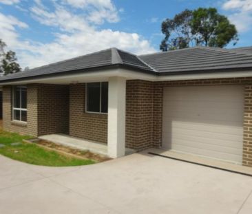 Neat 2-Bedroom Duplex - Water included - Photo 1