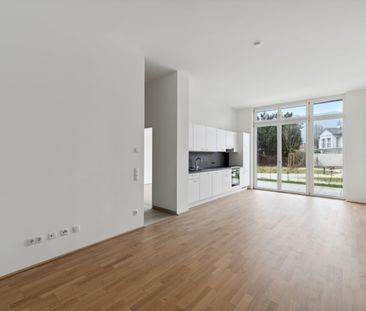 Moderne 2-Zimmer-Wohnung mit Eigengarten und Terrasse! - Foto 1