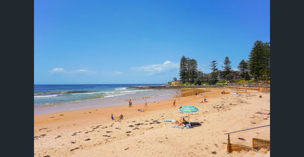 NORTH EAST FACING APARTMENT CLOSE TO THE BEACH! - Photo 1