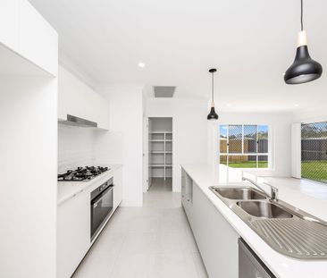 Near New Four-Bedroom Home with Ducted A/C & Media Room - Photo 1