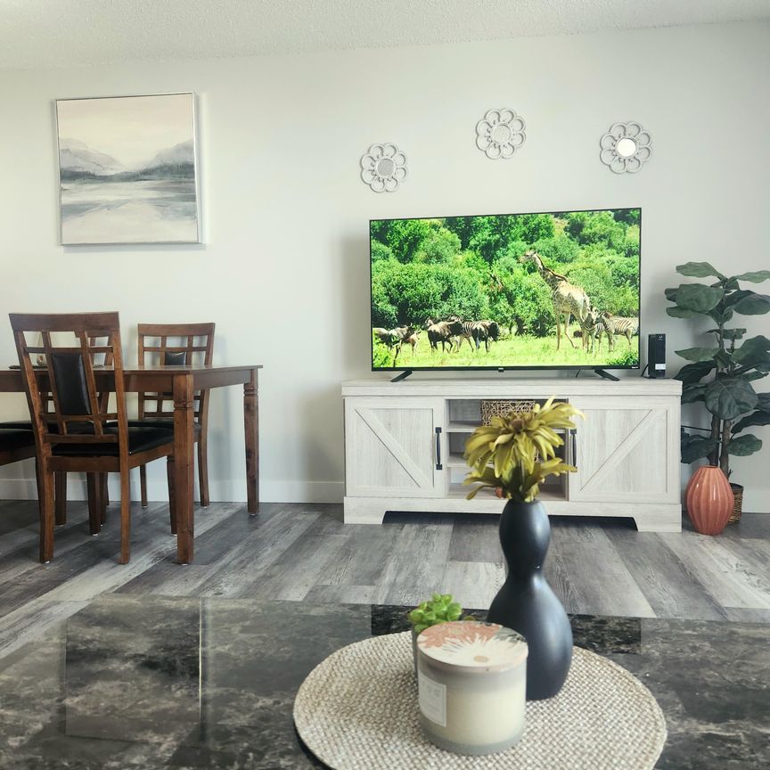 Beautifully Reno'd Two Bedroom Condo in Convenient Location at Checkmate Hill - Photo 1