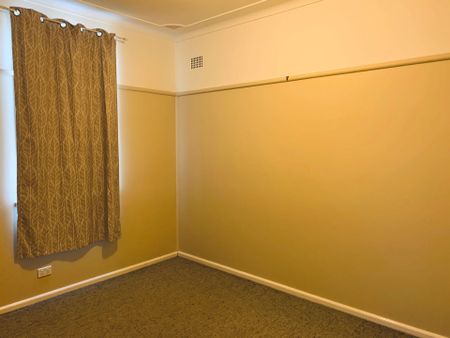 Charming Family Home with Spacious Backyard and Modern Comforts - Photo 2