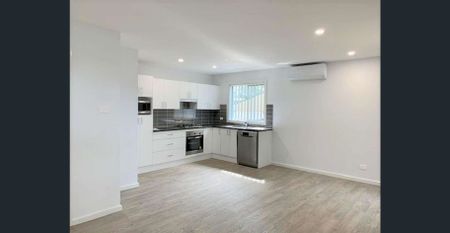 Modern & Secure Two-Bedroom Home in Prime Location - Photo 2