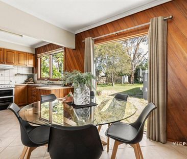 Charming Weatherboard Home with Expansive Backyard - Photo 2