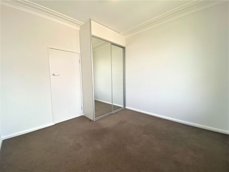 SUN DRENCHED TWO BEDROOM APARTMENT! - Photo 3