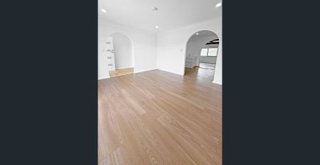 Renovated 3-Bedroom Home with Double Garage & Multiple Living Areas - Photo 5