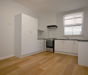 Neat & Freshly Painted 3 bedroom home - Photo 6