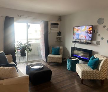TOP FLOOR CONDO ACROSS FROM OKANAGAN COLLEGE - Photo 1