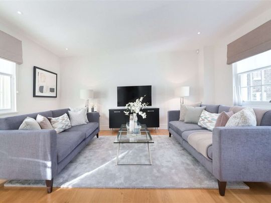 A luxuriously appointed two bedroom apartment in this converted period building in Belgravia benefitting from wood flooring. - Photo 1