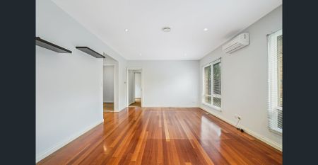 Three-Bedroom Single-Level Unit in Prime Location - Photo 4