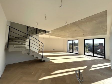 Exklusive und stilvolle Duplexwohnung im Erstbezug mit großer Terrasse und Tiefgaragenstellplatz im Herzen von Eupen - Photo 2