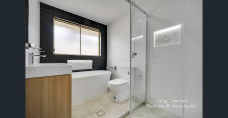 MODERN RENOVATED THREE BEDROOM HOME! - Photo 5