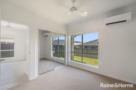 Modern Three-Bedroom Home in a Prime Location - Photo 4