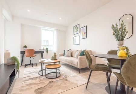 This contemporary two-bedroom apartment is located within Wallbrook Gardens, a beautiful development benefitting from exceptional on-site amenities, communal gardens and only a 6-minute walk to Canning Town Station. - Photo 2