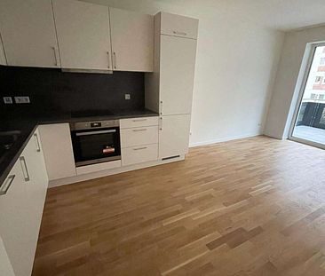 KfW 40-Neubau-Wohnung mit EBK, Balkon, Echtholzparkett, HWR, Fahrstuhl, Tiefgarage - Foto 4