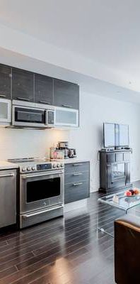 Furnished Bay St Condo w. 2TVs FREE Parking WALK to Sick Kids HOSPITAL - Photo 1