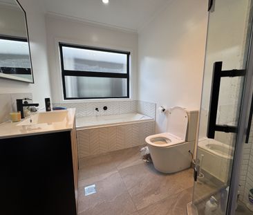 Nestled in the heart of Queenwood, this modern three-bedroom, two-b... - Photo 5