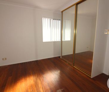 NEAT AND TIDY TOWNHOUSE WITH COURTYARD - Photo 1
