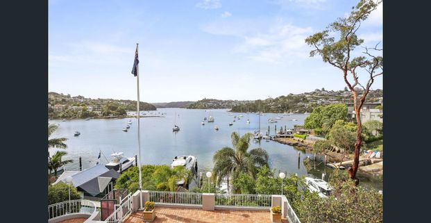 COASTAL ELEGANCE MEETS FAMILY COMFORT IN ONE OF MOSMAN'S MOST PRESTIGIOUS STREETS WITH PRIVATE JETTY - Photo 1