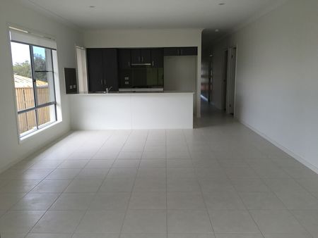 Family Home in Coomera Springs with Several Living Areas and Large Yard - Photo 5