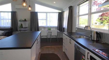 Warm & Welcoming Three-Bedroom Home with Double Garage - Photo 4