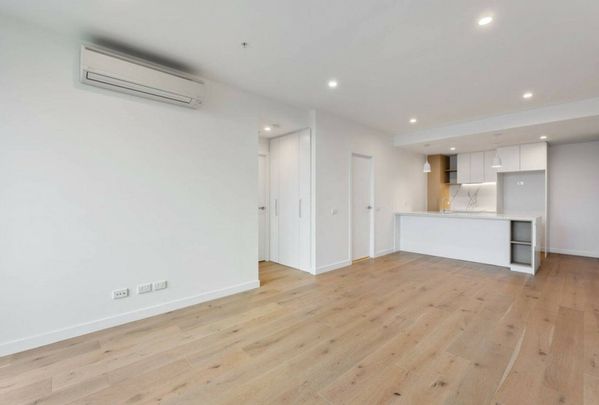 Modern Two-Bedroom Home with Oversized Balcony in Prime Location - Photo 1