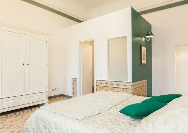 Center-Historic Jewish Quarter: Elegant apartment situated in beautiful Palazzo Nobiliare. Entrance, spacious living with original wood frescoed ceilings, large modern dining and kitchen, 4 bedrooms, 4 Baths, small terrace. #1527