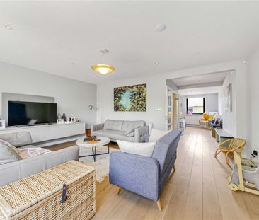 A recently redecorated mid-terrace townhouse, on this quiet road in... - Photo 1