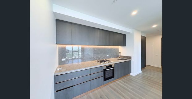 Modern Luxury Living in TRIO | Near-New 2B 2B 1CP Apartment - Photo 1