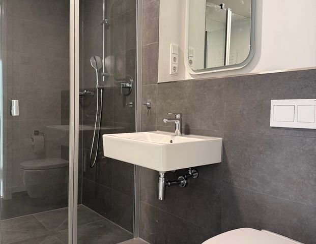 SANKT AUGUSTIN HANGELAR, 2 Zi. Neubauwohnung ca. 60 m² Wfl. mit Einbauküche, gr. Balkon u. TG-Stellp - Foto 1