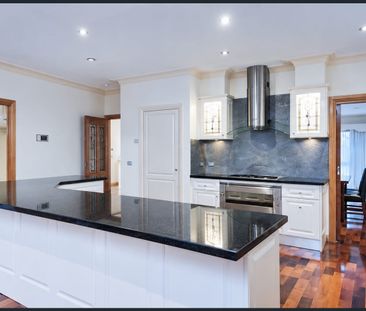 In a Class of Its Own – Partially Furnished Family Home with Pool & Wetland Views - Photo 4
