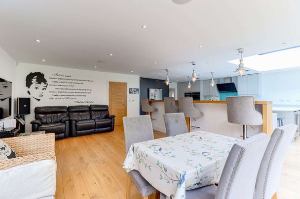 Five bedroom family home with driveway parking and lovely garden in a prime village setting. - Photo 1