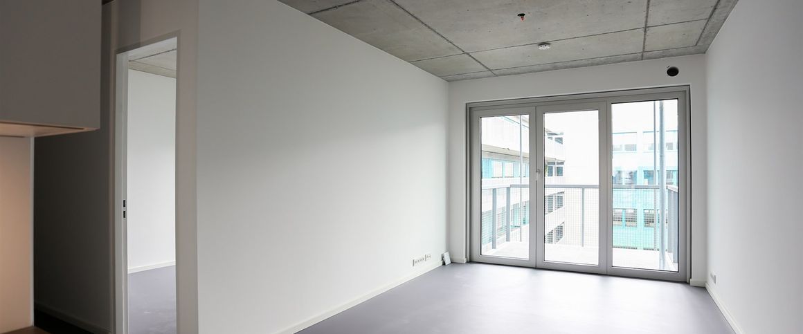 Ab sofort - Helle Neubauwohnung im 6. OG mit Sichtbetondecken, EBK und Smart Home-Features - Foto 1