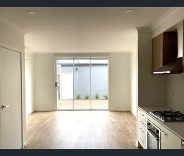 Stylish Two-Storey Living with Low-Maintenance Appeal - Photo 1