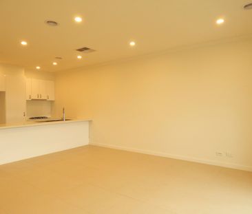 Bright and Spacious with Double Garage! - Photo 4