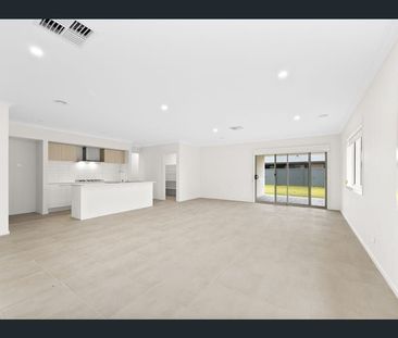 FOUR BEDROOM HOME WITH TWO LIVING AREAS AND DUCTED HEATING AND COOLING - Photo 1