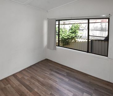 Charming Two-Bedroom Home in a Peaceful, Tree-Lined Street - Photo 6