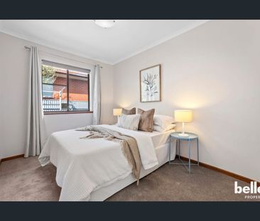 Modern 2-Bedroom Unit with Low-Maintenance Yard - Photo 3